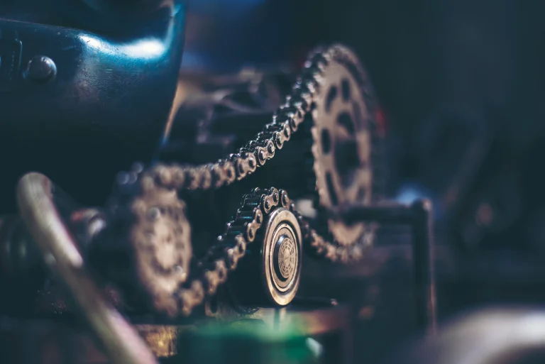 Chain of a machinery getting fixed.